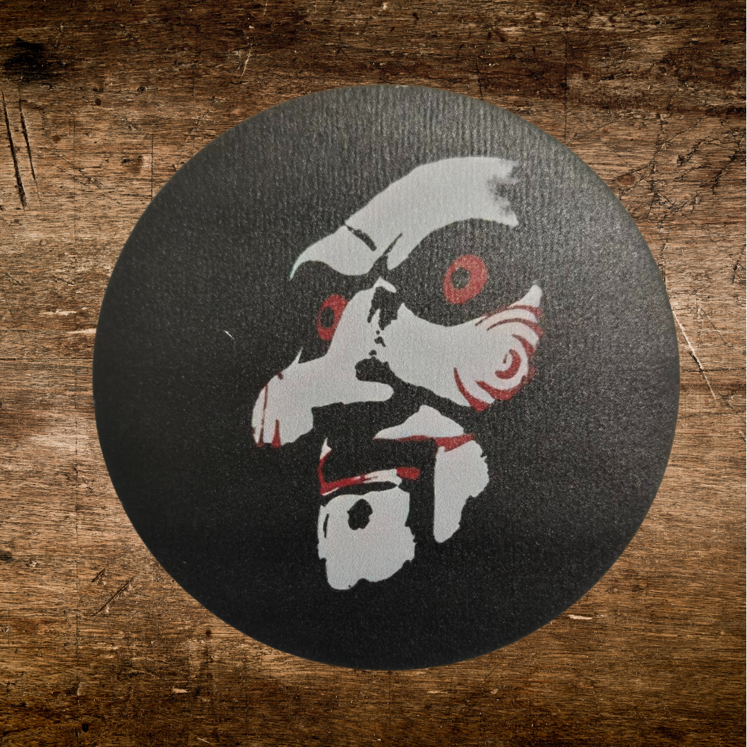 The head if jigsaw on a wooden coaster